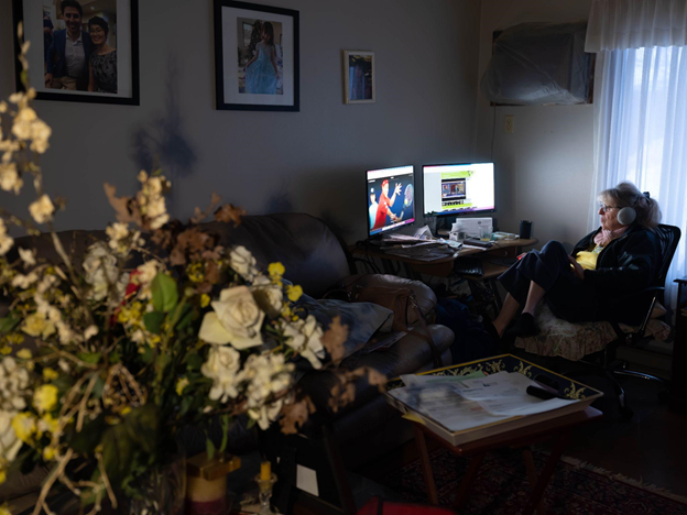 Photo of a woman watching Italian sports channels at home on her desktop
