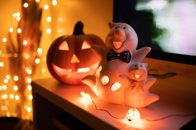 Halloween decorations with a pumpkin head and 