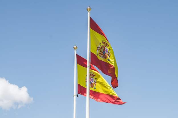 Photo of Spanish flags hanging high
