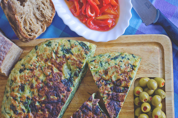 Photo of Spanish tapas with a Spanish omelette and olives