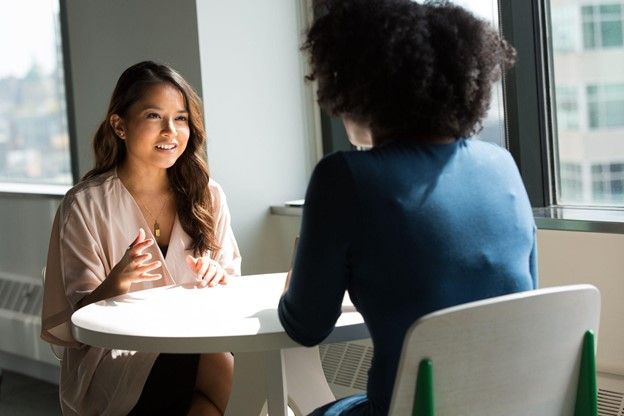 two women practicing Spanish conversation