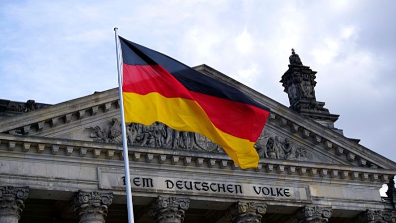 german flag in front of a historical building-longest words in german-Lingopie