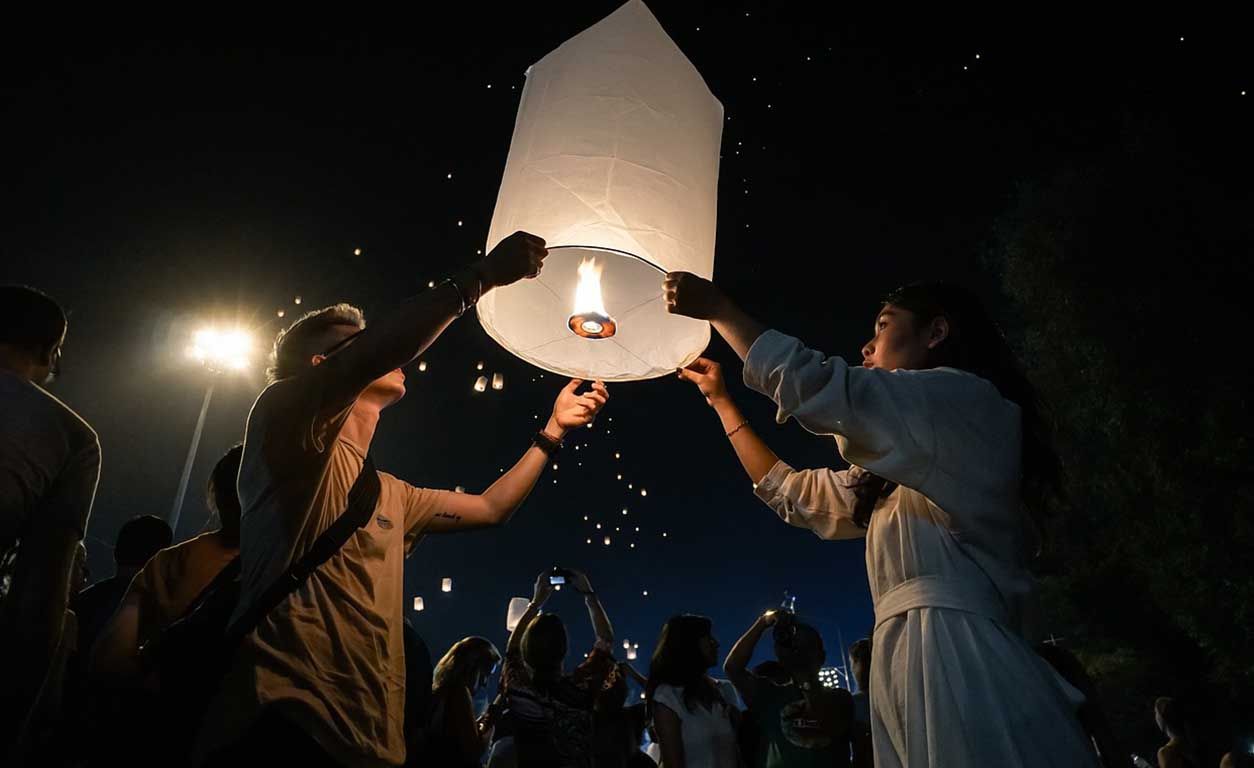 Couple letting go a lantern